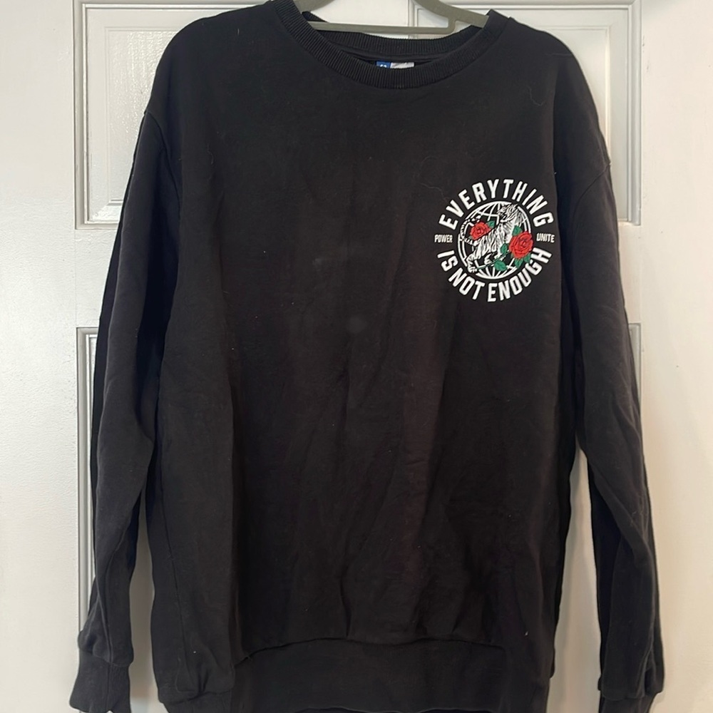 Black pull over sweater with tiger rose design